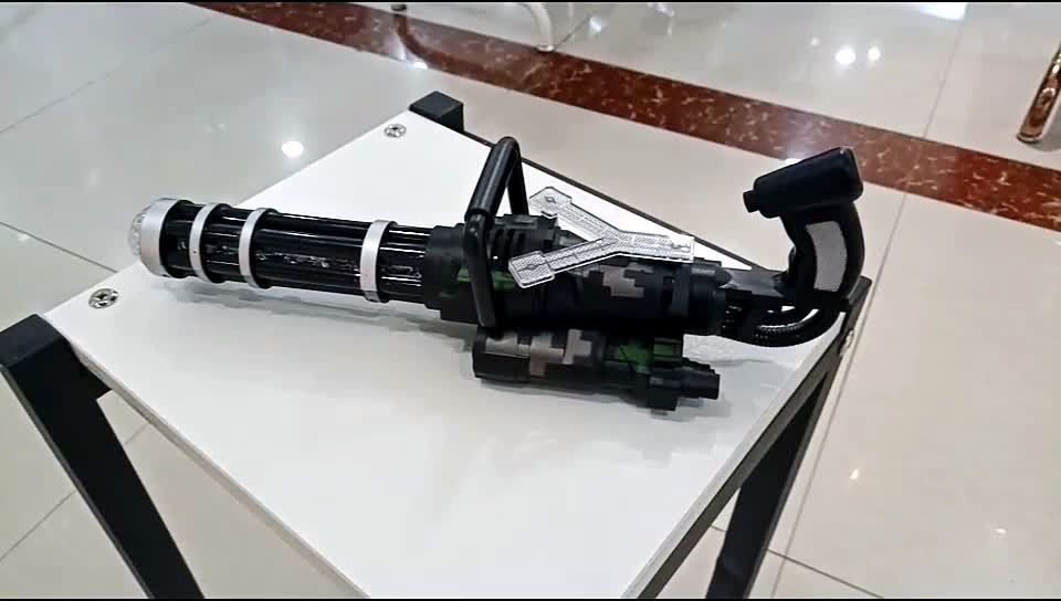 新款电动加特林,造型拉风,带投影,可手提